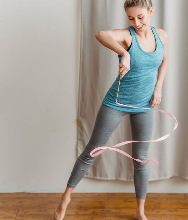 Young woman performing rhythmic exercises for better vitality and energy.